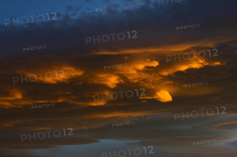 Burning clouds at sunset