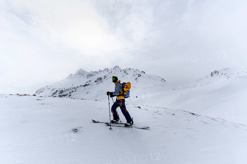 Ski tourers in the snow in fog