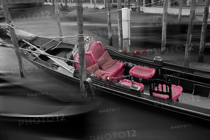 Gondola with fading red seat cushions