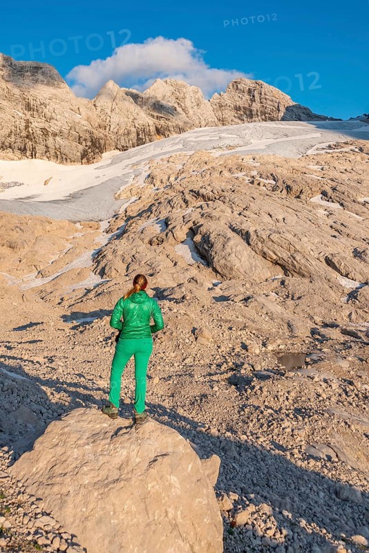 Hiker looks at alpine landscape