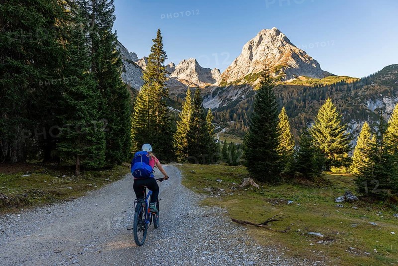 Mountain biker on gravel road to Seebensee