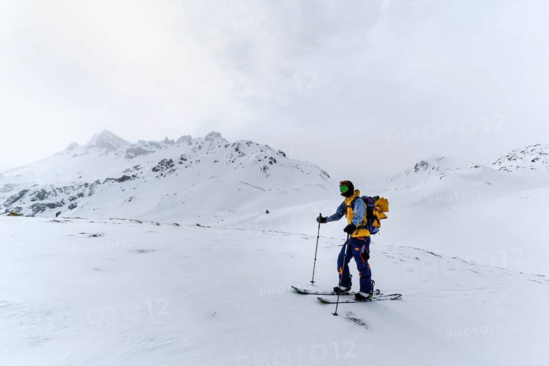 Ski tourers in the snow in fog