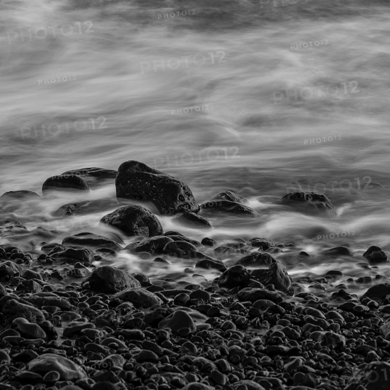 Water washes around stones