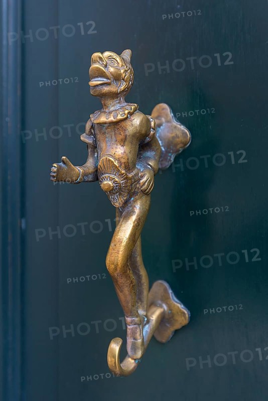Antique bronze figure as door knocker
