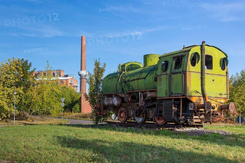 Old locomotive and factory buildings