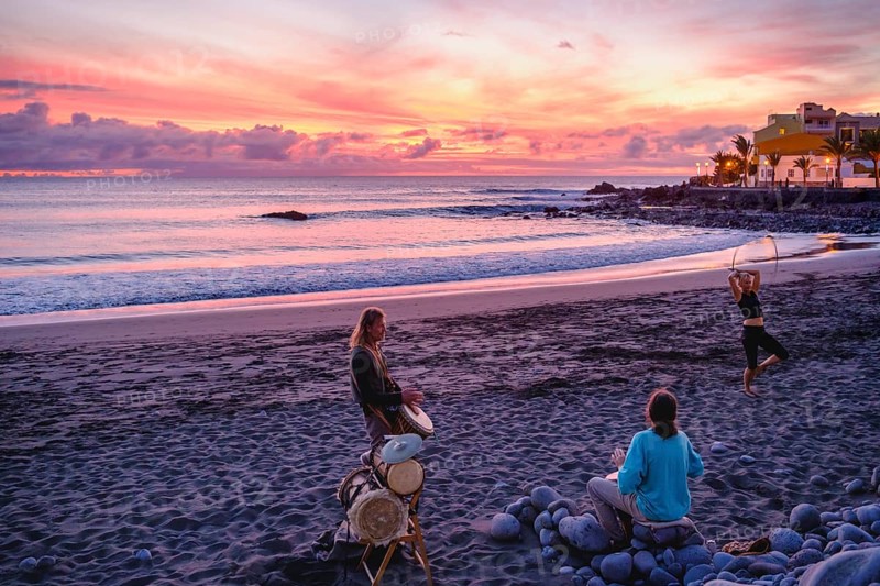 Drummers on the beach of La Playa at dusk