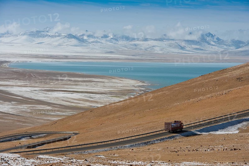 Truck driving pass from north on the way to sacred Namtso Lake