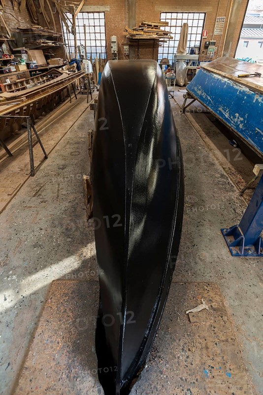 Freshly lined hull of a gondola in a boatyard on the island of Guidecca