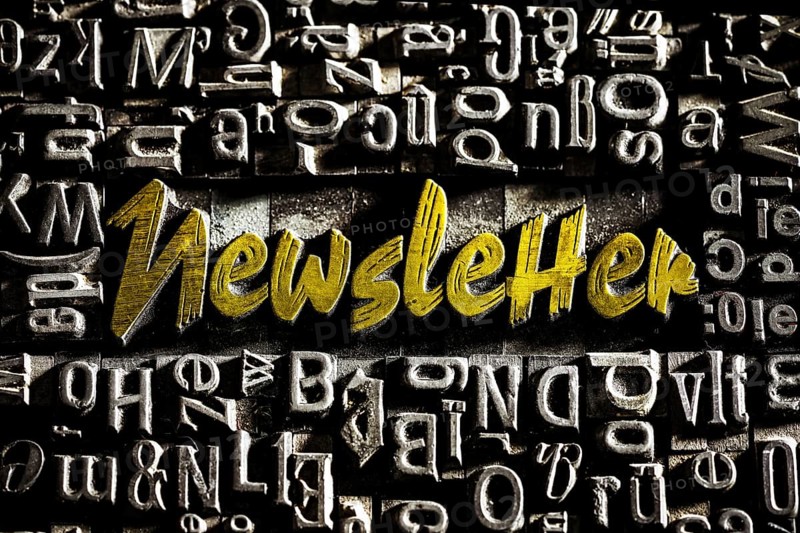 Old lead letters with golden writing show the word Newsletter