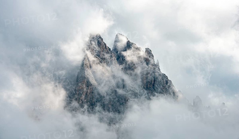 Cloud-covered rocky peaks