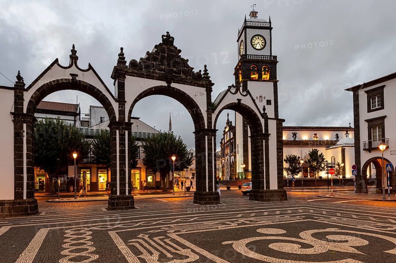 Portas da Cidade gates and the church of St. Sebastian in the evening
