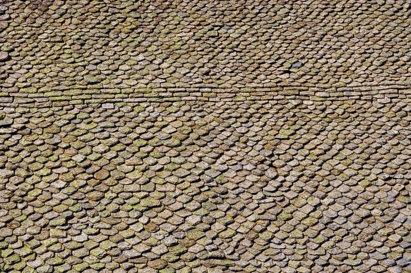 Church roof covered with stone tiles