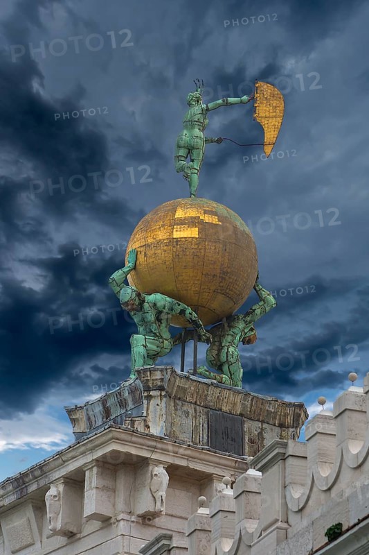 Sculptures of two Atlas figures with gilded globe