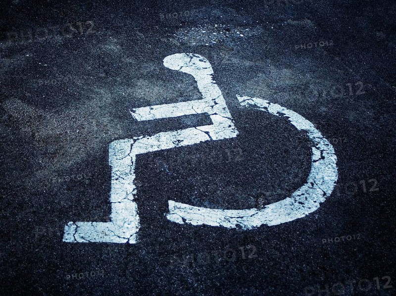 Pictogram of a disabled parking place on asphalt