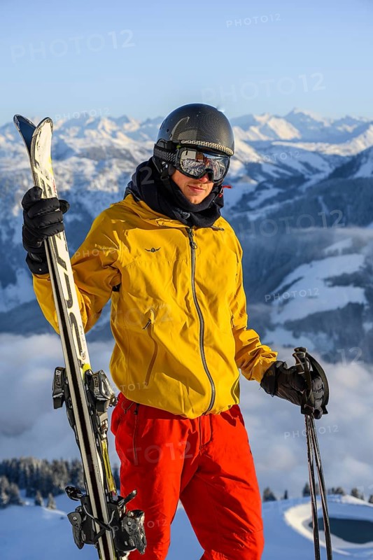 Skier in front of mountain panorama