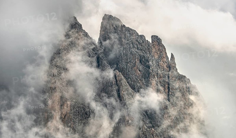 Cloud-covered rocky peaks