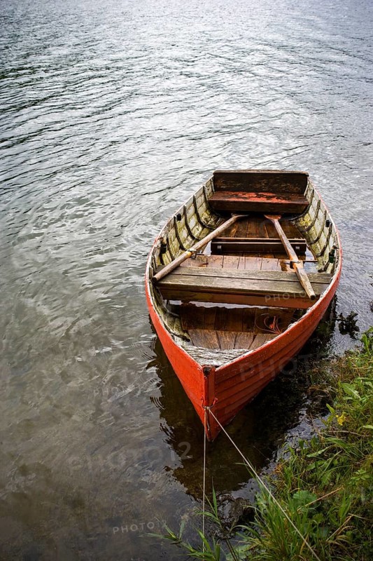 Red rowing boat on the banks of the Erlaufsee near Mariazell