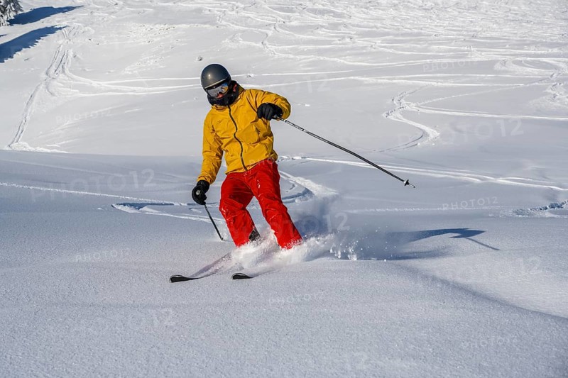 Skiers in deep snow