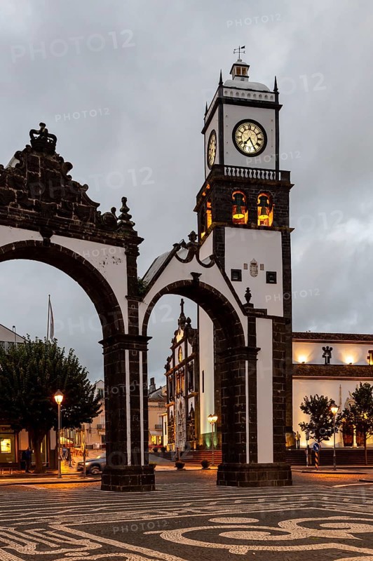 Portas da Cidade gates with the church of St. Sebastian in the evening
