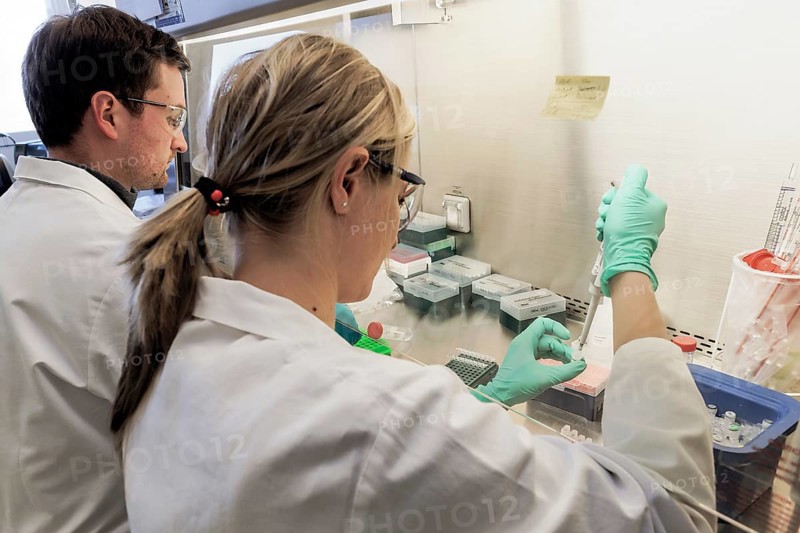 Laboratory technicians researching vaccine against coronavirus