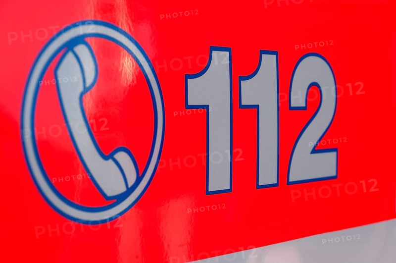 Inscription of the emergency number 112 on a rescue vehicle