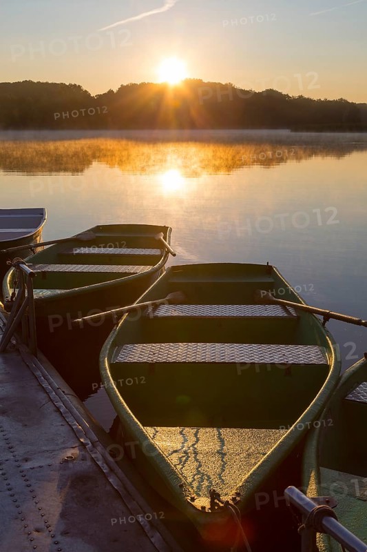 Sunrise with rowing boats