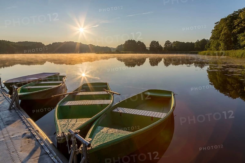Sunrise with rowing boats