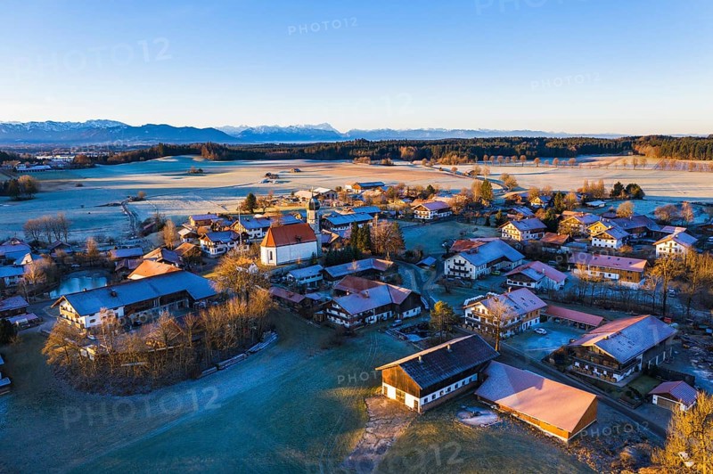 Village Lochen with church St. Magdalena in the morning light