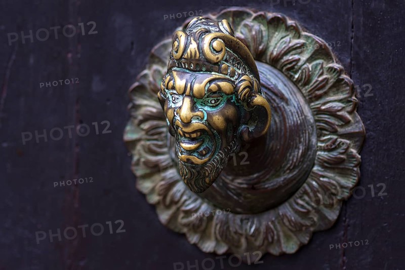Male bronze figure as doorknob