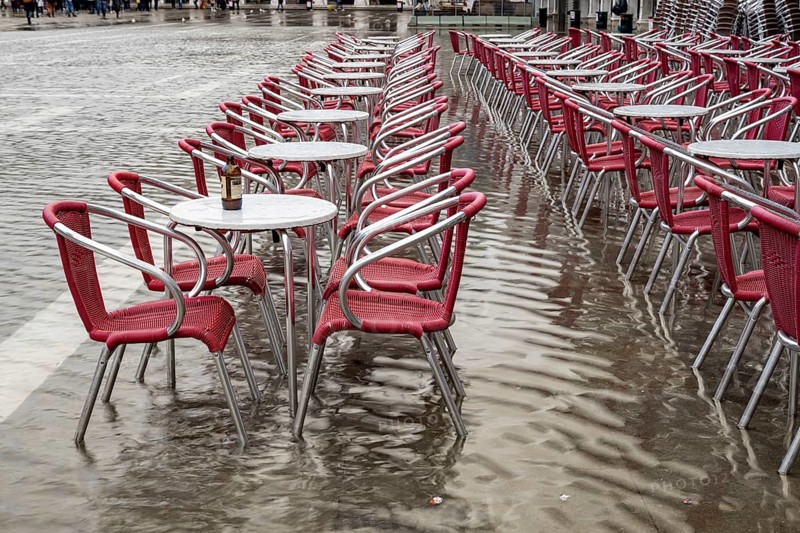 Tables and chairs are in the water at Acqua alta