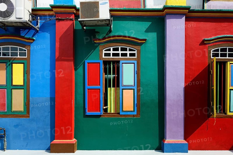 Colorful windows and facade of the old Chinese villa