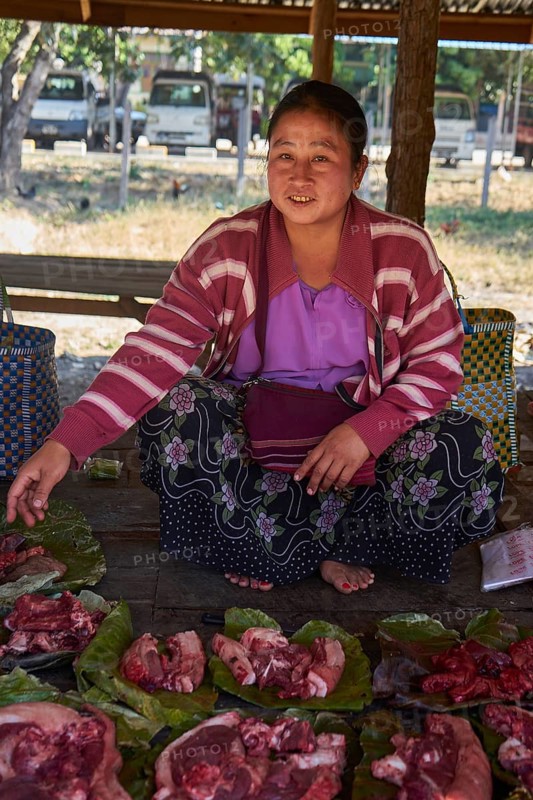 Market woman with pork