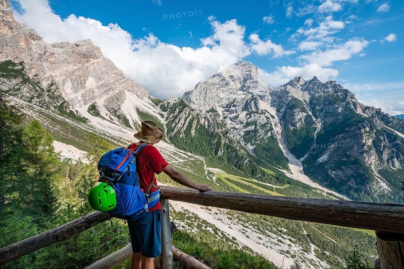 Hiker looking at the peaks of Cima Scooter and Cima Salvella
