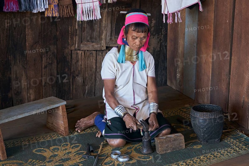 Padaung ethnic group woman making bracelets near Pan Pet village