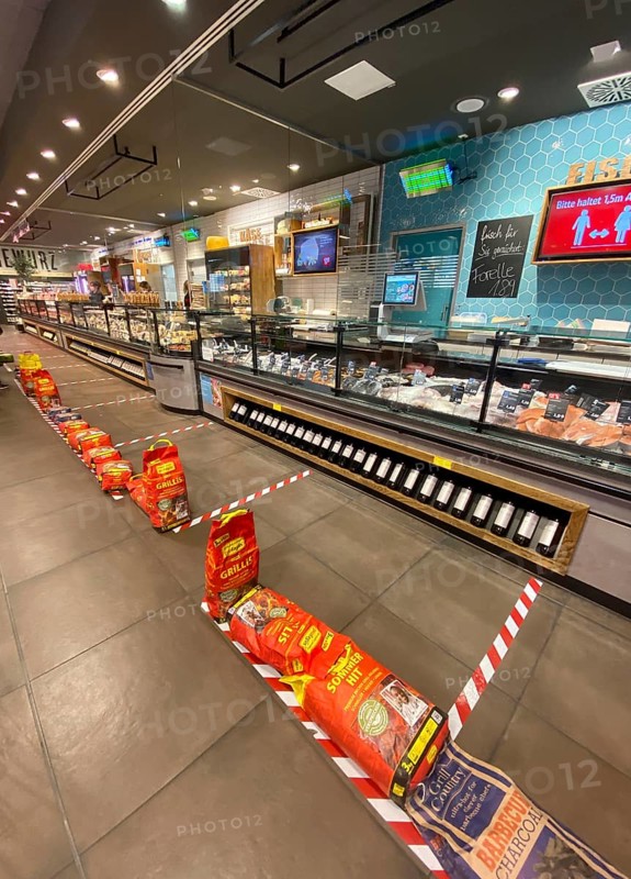 Barriers in supermarket for social distancing at fish counter