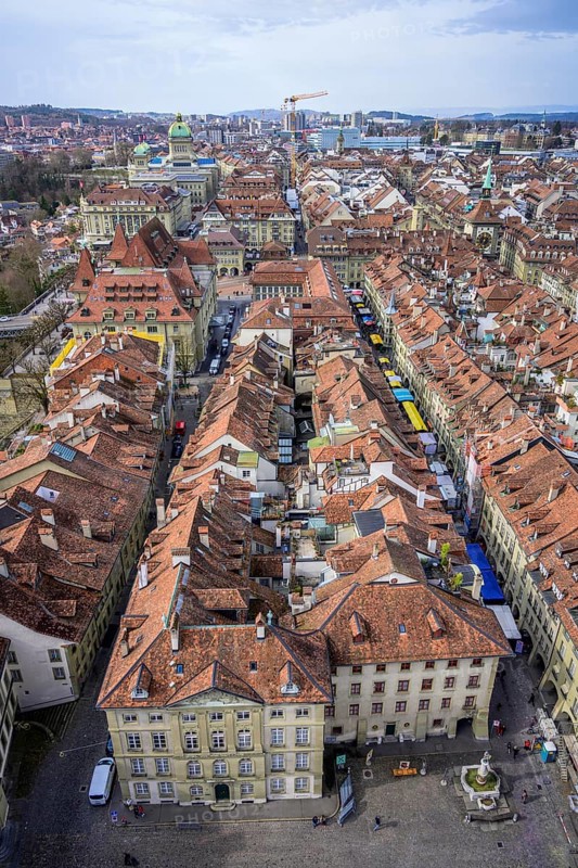 View from the Bernese Minster to the Muensterplatz and the red tiled roofs of the houses in the historic centre of the old town