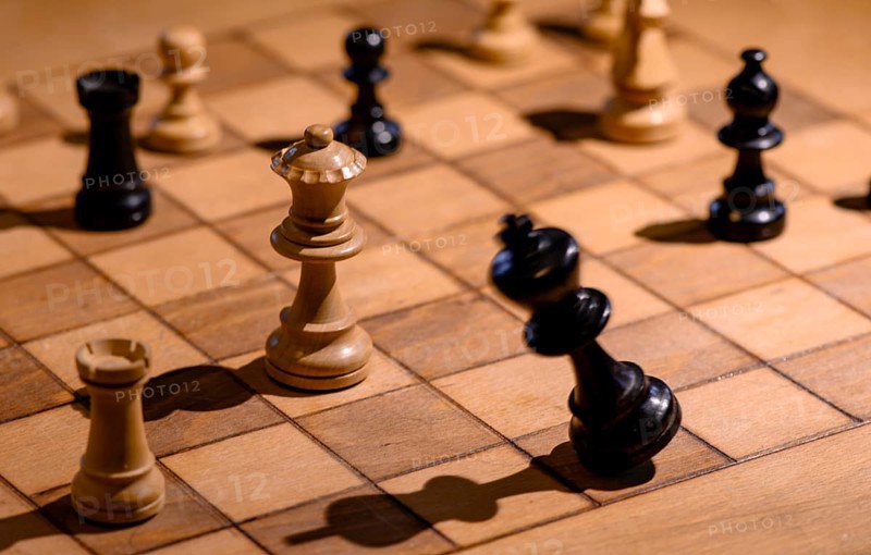 Chessboard with wooden chessmen