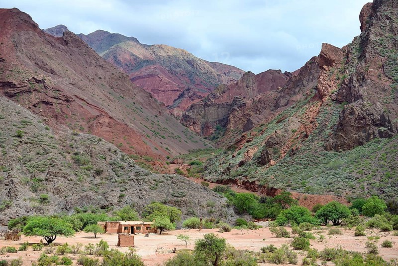 Lonely house in front of barren mountains