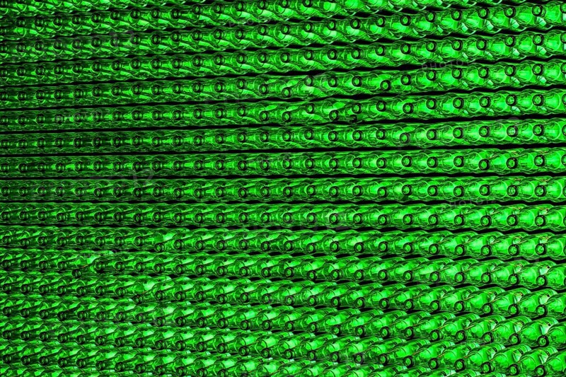 Empty green beer bottles on the conveyor belt