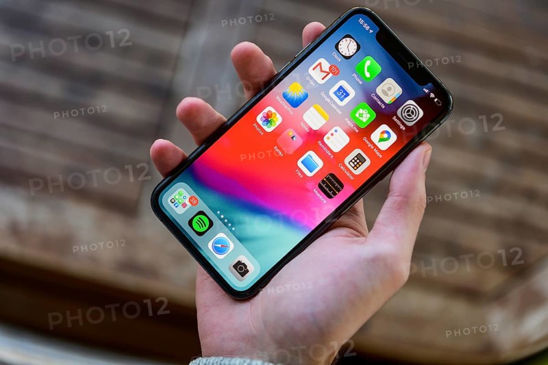 Hand holding iPhone 11