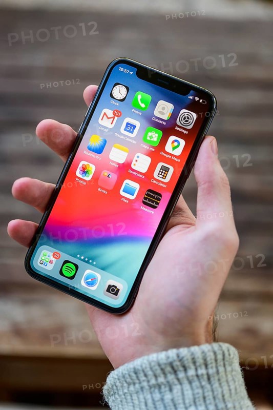 Hand holding iPhone 11