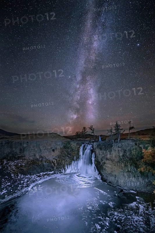 Orchon waterfall at night with starry sky and Milky Way