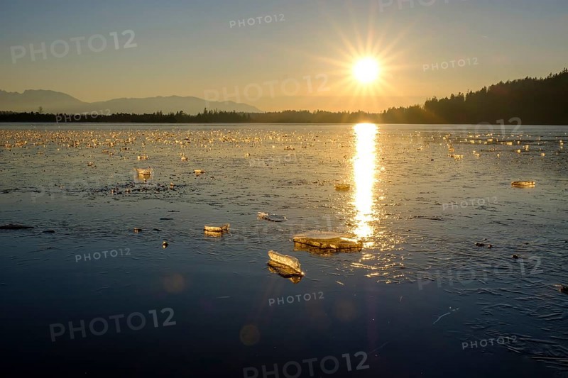 Small ice floes on frozen lake in winter