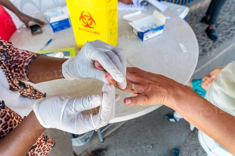Nurse does a quick malaria test from blood on the South Africa and Mozambique border Lebombo Border Control