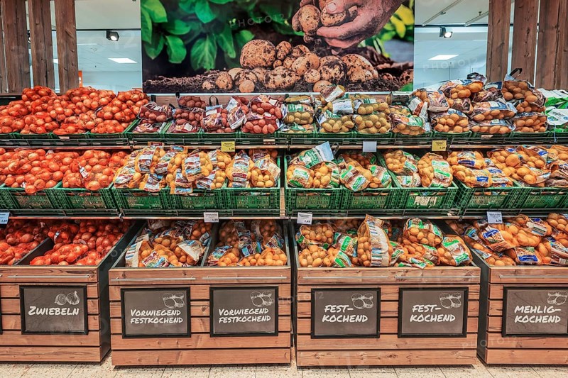 Shelf with onions and potatoes