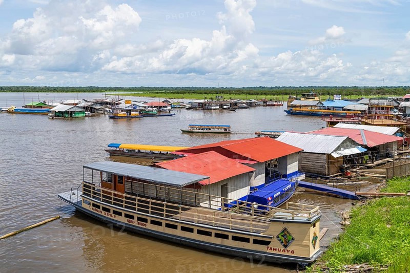 Wooden ships and floating houses in the port