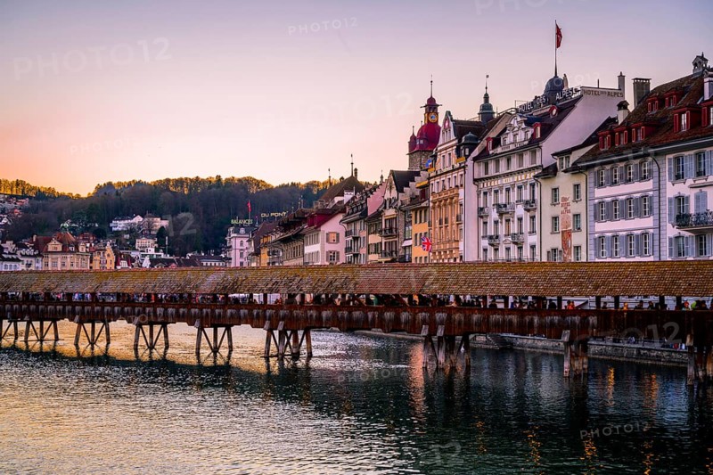 View over the river Reuss to the Chapel Bridge at sunset