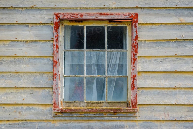 Weathered wooden facade with window, Saunders Island
