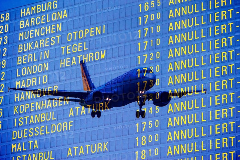 PHOTO MONTAGE, arrival and departure board at the airport