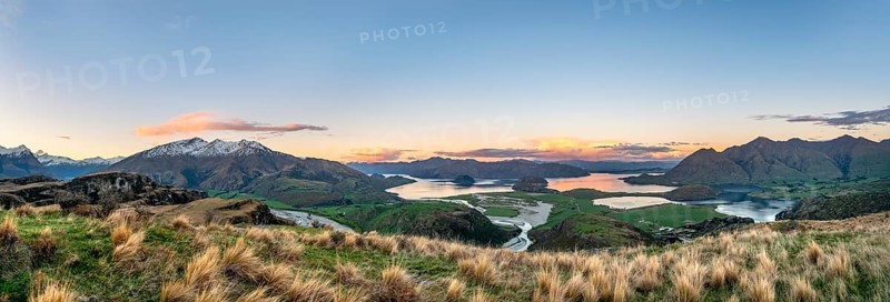 Sunset, panorama view on Wanaka Lake and mountains